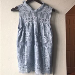 Baby blue blouse. Not see through.